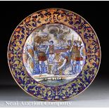 Pair of Italian Faience Chargers, c. 1900, painted with copper and gilt metallic Roman scenes,