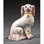 Delft Manganese Decorated Pottery Spaniel, 18th/19th c., modeled seated on its haunches wearing a
