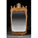 George II-Style Carved Giltwood Mirror, scrolled foliate crest centered by a shell, molded surround,