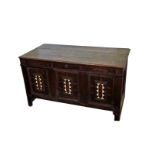 A 19th century oak chest, the hinged lid formed from three planks and opening to reveal an