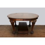A Victorian mahogany extending dining table with gadrooned rim and two additional leaves, raised
