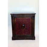 A Victorian rosewood side cabinet with scroll carved pilasters, pierced scroll carved door with