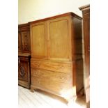 A George III mahogany linen press with two panel cupboard doors opening to reveal four interior