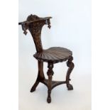 A Victorian mahogany hall chair with acanthus leaf and shell carved cresting rail, grotesque mask