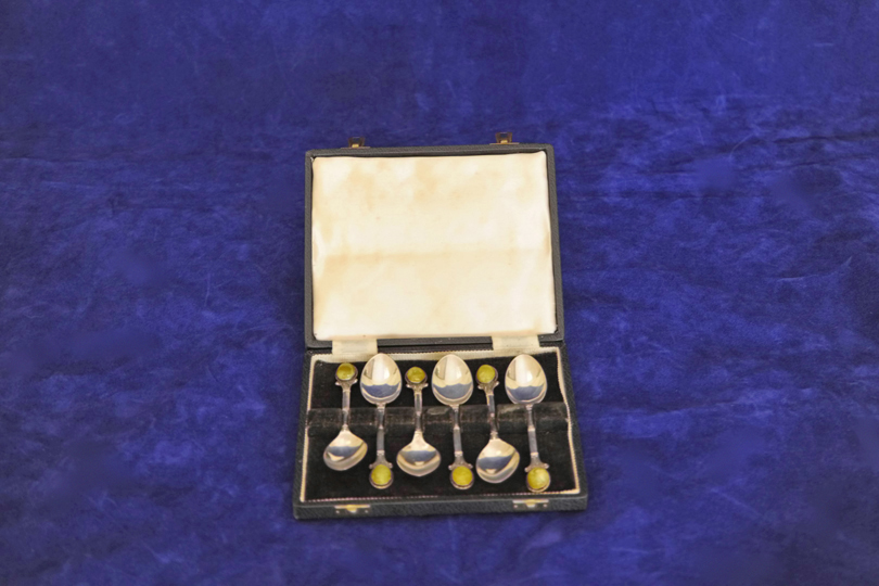 A matched set of six Elizabeth II silver teaspoons with quartz set handles and reeded stems. One