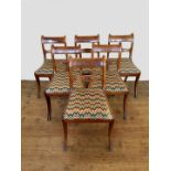A set of six late Victorian mahogany and ebony strung dining chairs with curved cresting rails,