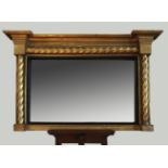 A late 19th century gilt framed overmantel mirror with rope twist effect decoration and ebonised