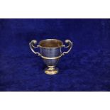 An Edward VII silver twin handled trophy cup with engraving, West Norfolk Hunt PT. to PT.