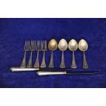 A canteen of .800 white metal cutlery with acanthus leaf cast decorated handles comprising