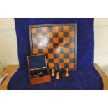 A Jacques London chess set comprising thirty two pieces together with a chess board with bone inlay.