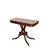 A Victorian mahogany satinwood and boxwood strung 'D' shaped card table, the fold-over top opening