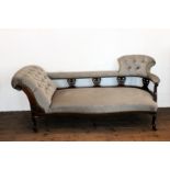 A Victorian mahogany chaise longue with button back and pierced scroll carved supports and
