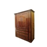 A Victorian mahogany linen press with twin panelled cupboard doors opening to reveal five interior