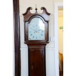 An 18th century longcase clock, the hood with broken arch pediment and reeded pilasters, the