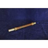 A British First World War brass and leather cased telescope by T.Cooke & Sons Ltd., London and