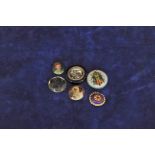 A collection of buttons decorated with dogs, foxes, birds etc.