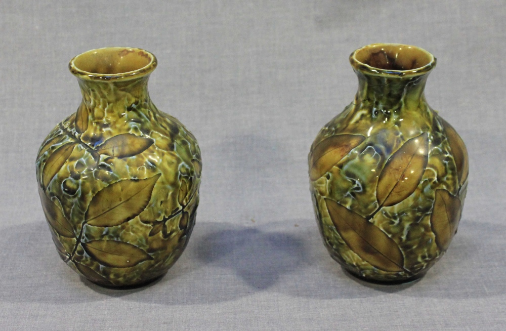 A pair of Doulton Lambeth stoneware pottery vases of ovoid form with olive and brown glazes and