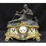 A 19th Century gilt bronze and spelter figural mantel clock, mounted with a statue of a wounded