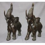 Two large cast and patinated bronze figures of elephants.  43cm high.
