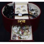 A small quantity of costume jewellery in a burgundy leather jewellery box