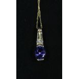 A 14k gold, Tanzanite and Diamond pendant and necklace, the pendant measuring 19.3mm x 5.8mm set