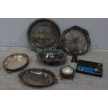 A silver plated bread dish, an entree dish, two salvers and other plate.