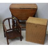 A stained oak drop-leaf oval supper table with barley-twist supports, together with a child's