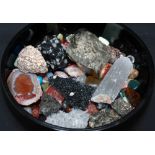A collection of natural and polished rocks and minerals, including Blue John, agate, jet,