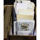 A quantity of 1st day covers, various postcards, an album of cigarette cards, etc.