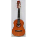 A modern "Infante" acoustic guitar, made in Spain, pine top, mahogany back.