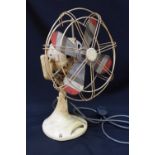 A vintage B&Y Beanwy electric table fan, with heavy metal case, oscillating variable speed motor, in