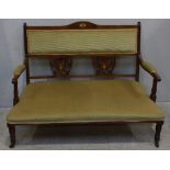 An Edwardian mahogany framed two-seater parlour sofa, with foliate-carved and pierced back splats,