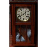 A 1920s oak-cased pendulum wall clock, with white dial, Roman numerals, 73cm