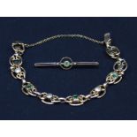 A 9ct gold and Peridot bracelet, together with a 9ct gold and Peridot bar brooch, 14.7 grams