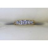 An antique graduated five stone diamond ring, the diamonds approx. weight a total of one carat,