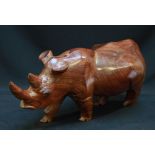 A 20th century Africa hardwood carved figure of a rhinoceros, 60cm long