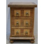 A good quality modern hardwood parquetry small chest of three short drawers, with burr-wood panels