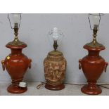 A pair of turned stained-wood table lamps of baluster form with ring handles, together with a