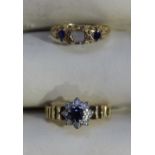 An 18ct gold ring set centrally with a round sapphire surrounded by eight small diamonds, together