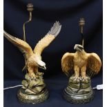 A pair of resin table lamps moulded as eagles, with the shades.