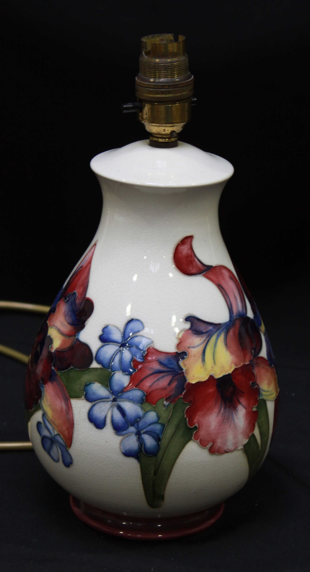 A Moorcroft "Orchid pattern" table lamp of baluster form, WM mark and part paper label, 23cm