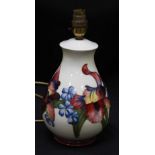 A Moorcroft "Orchid pattern" table lamp of baluster form, WM mark and part paper label, 23cm
