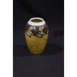 A Royal Doulton ovoid vase with trailed honey glaze decorated with incised stylized overglaze leaves