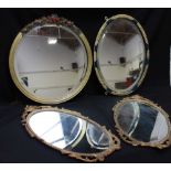 A pair of modern gilt-metal oval mirrors, 50cm high, together with two various gilt-framed wall