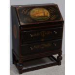 An early 20th century bureau, with sloped front above a pair of drawers raised on bulbous