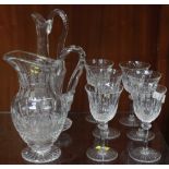 A Saint-Louis glass water jug, wine decanter and stopper, and six tall stemmed wine glasses.