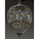 A modern brushed metal and cut-glass hanging lightshade, of ovoid pendant form, hung with clear