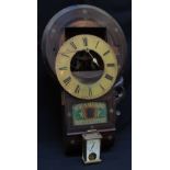 A "Superior Regulator" circular wall clock with circular dial and painted glass pendulum door, (