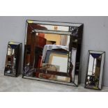 A modern mirror with leaded panels, 53 x 53cm, together with a pair of matching mirrored candle