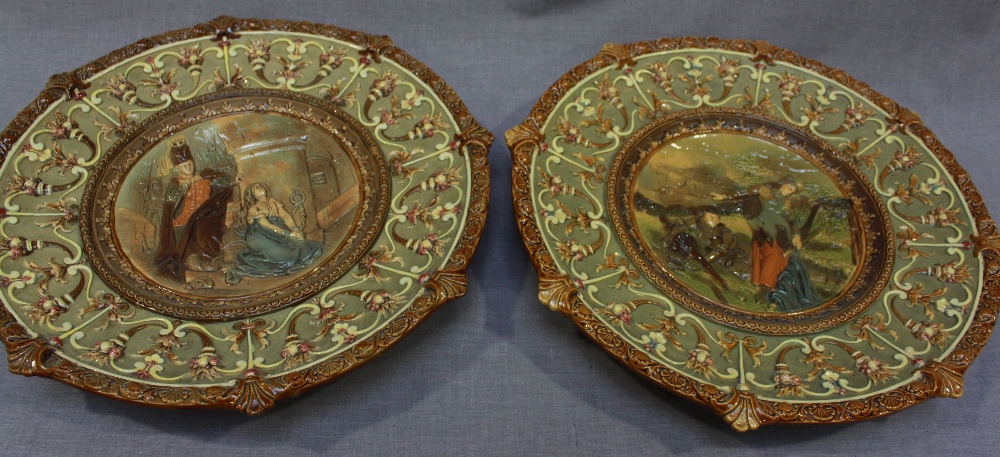 A pair of 19th century majolica chargers, moulded in the Renaissance Revival "style" with two
